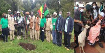 Dr. Eston Mutitu (mid of flags) with Mau Mau freedom fighters/veterans during the tree planting and presentation of the gift to Mrs Mukami Kimathi, in marking the 101 Dedan Kimathi birthday.